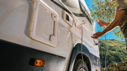 Cavu rv mobile tech repairing exterior shower hose on camper in greenville sc