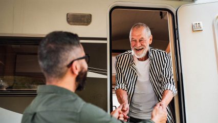 Rv tech greeting senior owner for walkthrough orientation in upstate sc